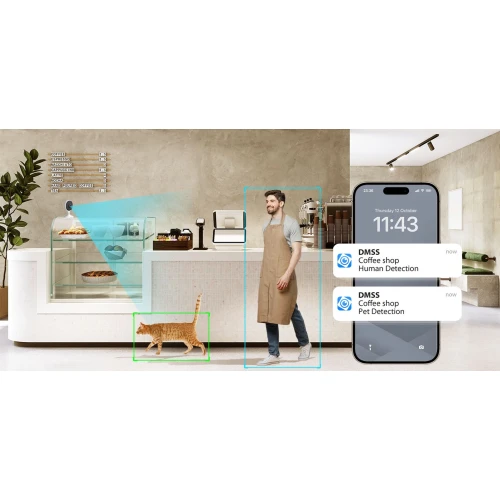 Na zdjęciu widać wnętrze kawiarni z mężczyzną w fartuchu stojącym za ladą oraz kotem przechodzącym obok. Obok znajduje się telefon z powiadomieniami o wykryciu człowieka i zwierzęcia.