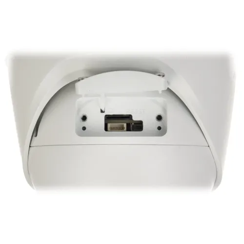 Zdjęcie przedstawia zbliżenie na gniazdo karty pamięci oraz przycisk reset na białym urządzeniu elektronicznym. Widać wyraźnie porty i oznaczenia na obudowie.