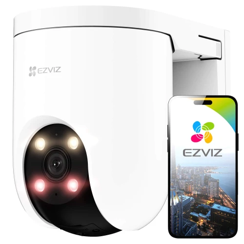 Biała, obrotowa kamera bezpieczeństwa EZVIZ H8 z widocznymi diodami LED i obiektywem, obok której znajduje się smartfon z aplikacją EZVIZ pokazującą widok miasta. Kamera ma nowoczesny design i jest przeznaczona do monitoringu zewnętrznego.