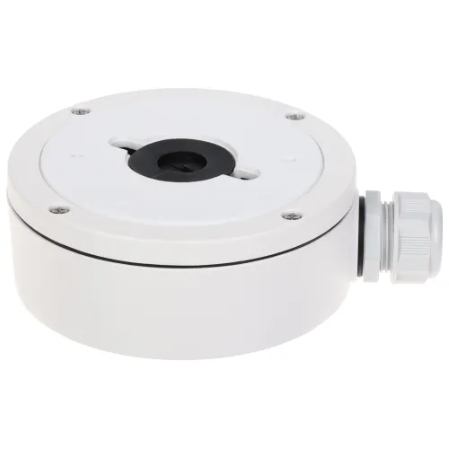 Na zdjęciu znajduje się okrągła, biała puszka montażowa z otworem na środku i bocznym wejściem na przewody. Puszka ma metalowe wykończenie i jest przeznaczona do instalacji kamer monitoringu.