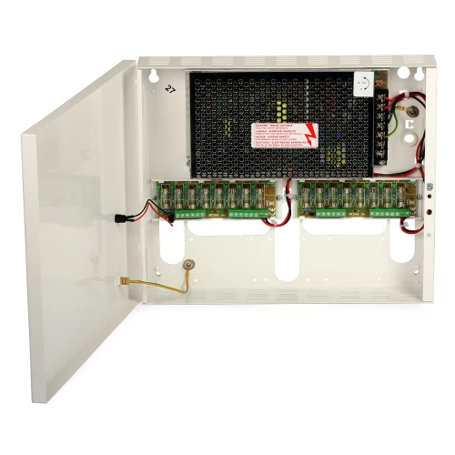 Otwarta metalowa obudowa z zasilaczem impulsowym i wieloma podłączonymi przewodami oraz terminalami. Wnętrze zawiera również wentylację i oznaczenia ostrzegawcze.