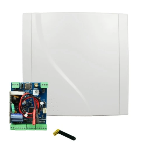 Na zdjęciu znajduje się biały panel komunikacyjny oraz otwarta płytka elektroniczna z widocznymi komponentami i okablowaniem. Obok nich leży mała, czarna antena.